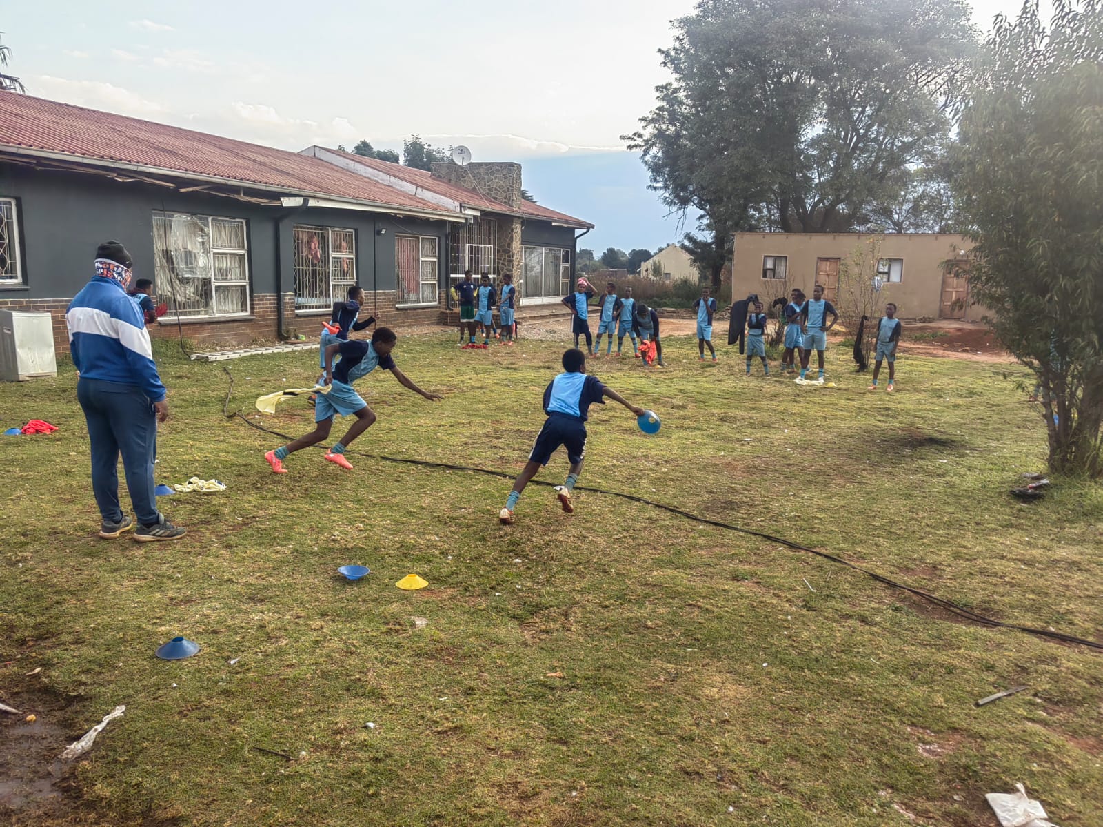 Boys training on rough ground